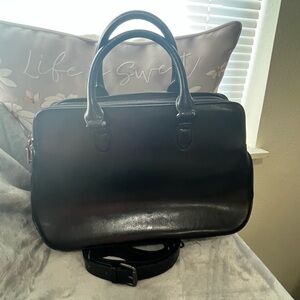 HESHE  three compartment, black leather bag with strap.